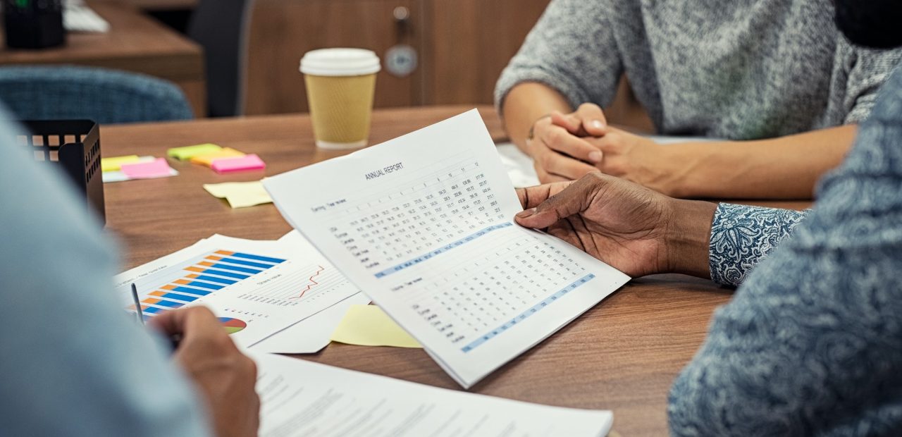 Businessman reading annual report